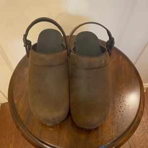 Never worn. Dansko clogs with heel strap